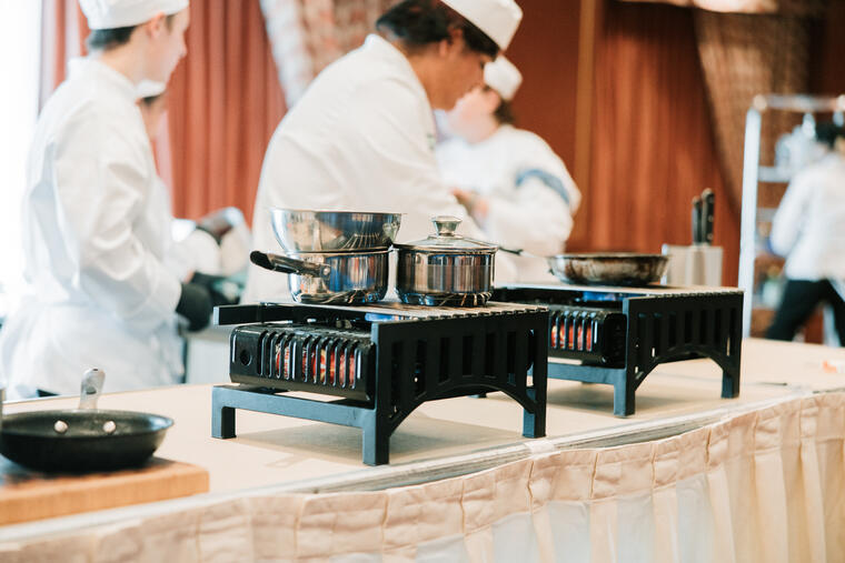 Students cooking at the Invitational